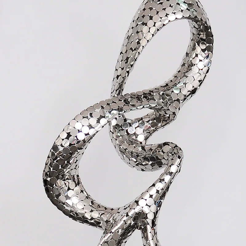 Custom reflective metal artwork and architectural metalwork detail